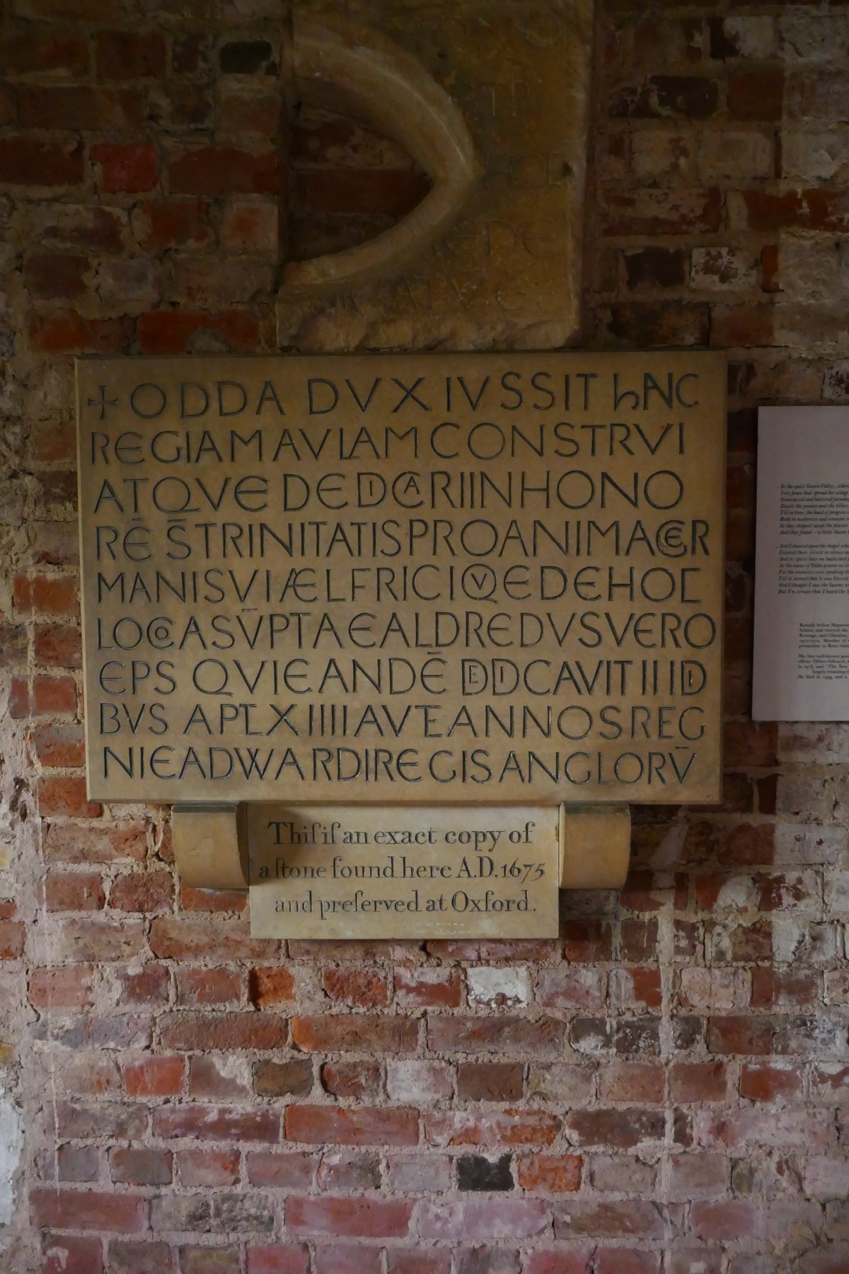 The dedication plaque records that the chapel was built in 1056